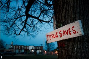 A sign nailed to a tree punctuates the dusk Thursday, March27, 2014, outside a neighborhood in Baltimore, Md. LCMS Communications/Erik M. Lunsford