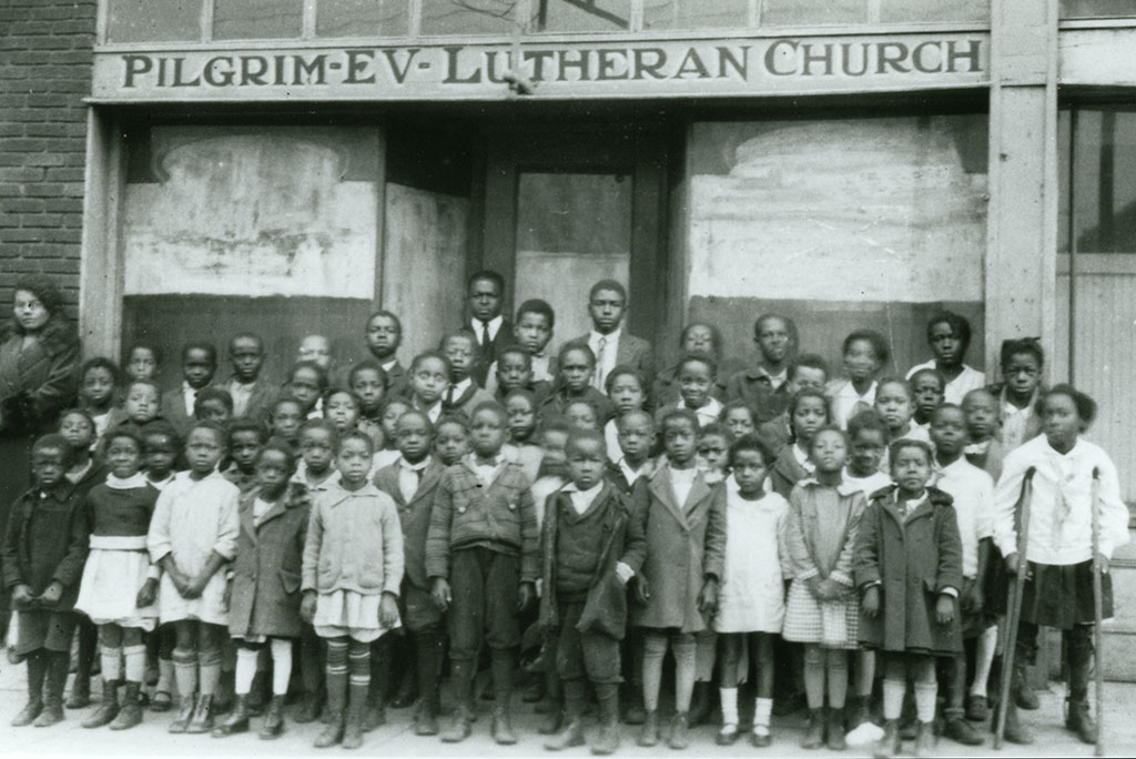Rev. WM Eddleman (rear) and school children are pictured on Dec. 1, 1927, in front of Pilgrim Evangelical Lutheran Church in Birmingham, Ala. (Courtesy of Concordia Historical Institute)