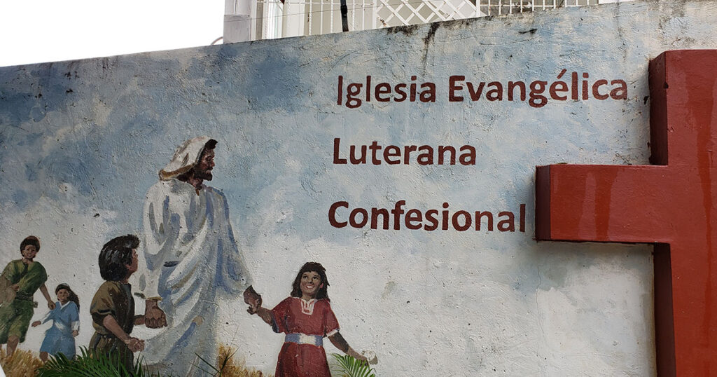 A mural of Jesus with children is painted outside of a church in the town of Palmar Arriba in the Dominican Republic. A group of Concordia Seminary, St. Louis students were in the Dominican Republic in XXX for a short-term mission education trip.  (Photo courtesy of Jason Groth.)