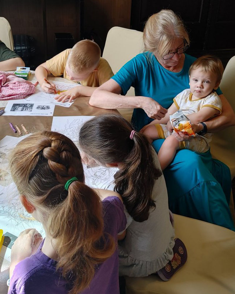 Tracy Beasley, an LCMS Short-Term Mission team member from Good Shepherd Lutheran Church in Roanoke, Va., holds an international worker’s child during a trip to Asia in December 2023 and January 2024. (Con-Ning Yen)