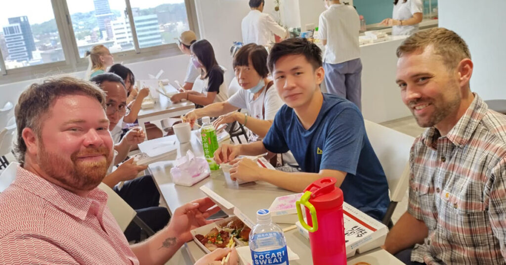 Tommy, second from right, helps interpret Mandarin during lunchtime conversation with LCMS Short-Term Mission volunteers at the English Bible Camp in Taiwan in 2024. (Holy Word Church)