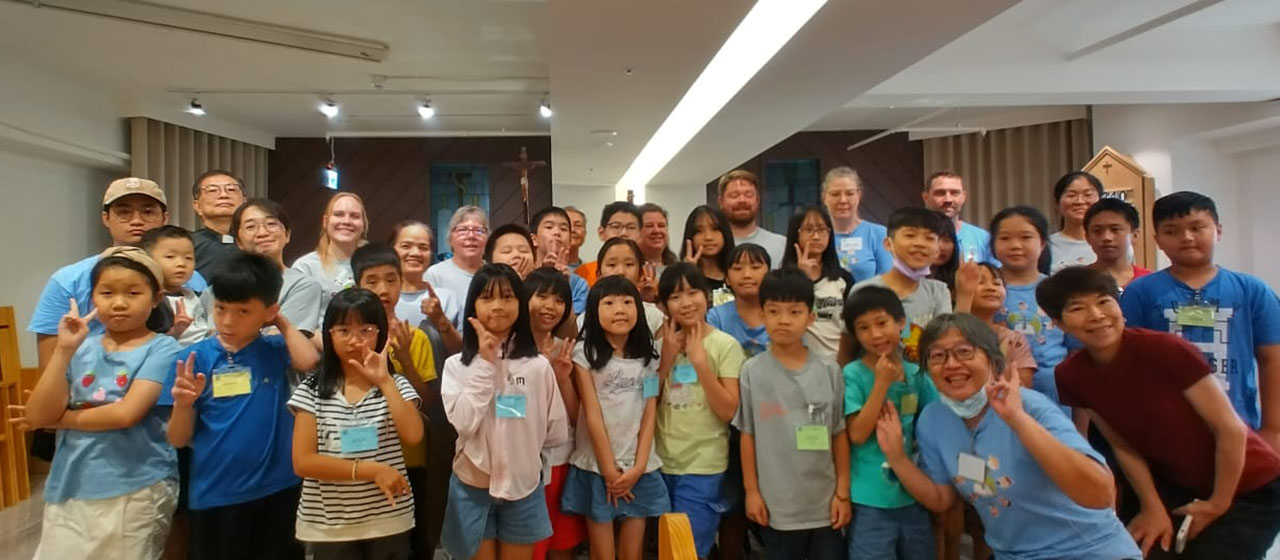 LCMS Short-Term Mission volunteers pose with participants of the English Bible Camp at Holy Word Church in Hsinchu City, Taiwan, in July 2024. (Holy Word Church)