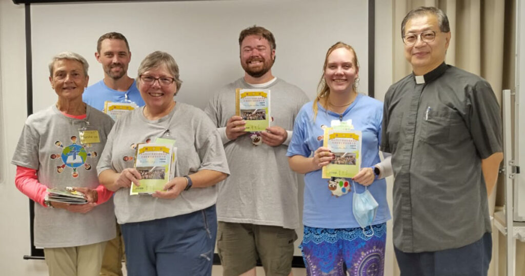 LCMS Short-Team Mission volunteers hold pop-up books with the Bible stories for the week during a July 2024 English Bible Camp in Taiwan. The Rev. Dr. Joseph Lu, pastor of Holy Word Church in Hsinchu City, Taiwan, is pictured at right. (Cynthia Han)