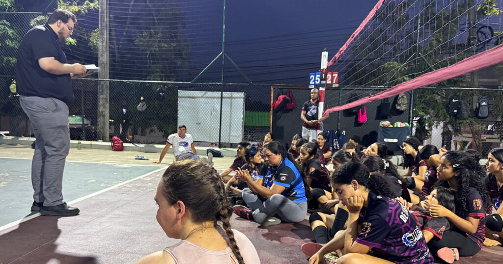 Vicar Gavin Johnson leads devotions with the Chamos All Stars team in the Dominican Republic. (Photo courtesy of Dana Stigdon.)