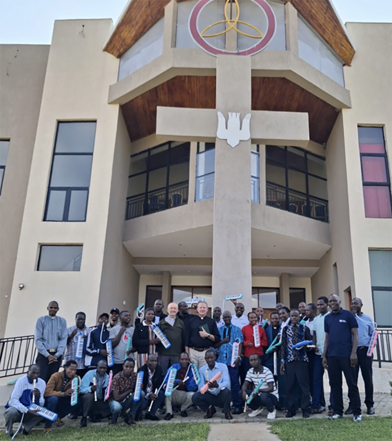 Pastors, deaconesses and choirmasters outside the Chapel of the Cross at Neema Lutheran College during the fourth week of an eight-week music program. Students are holding instruments provided by Lutheran Heritage Foundation. (Photo courtesy of Rev. Brian J. Hamer.)