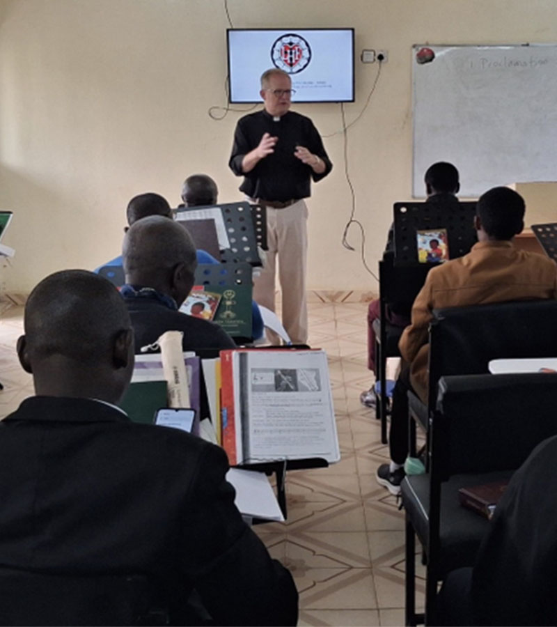 Rev. Hamer teaches Music Enrichment on the campus of Neema Lutheran College, Matongo, Kenya. (Photo courtesy of Rev. Brian J. Hamer.)